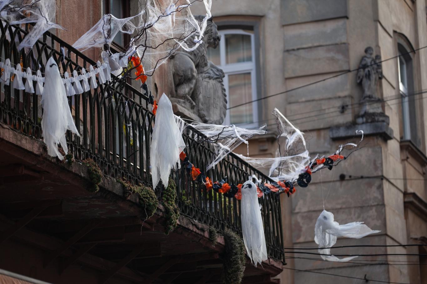 An apartment balcony adorned with Halloween decor.