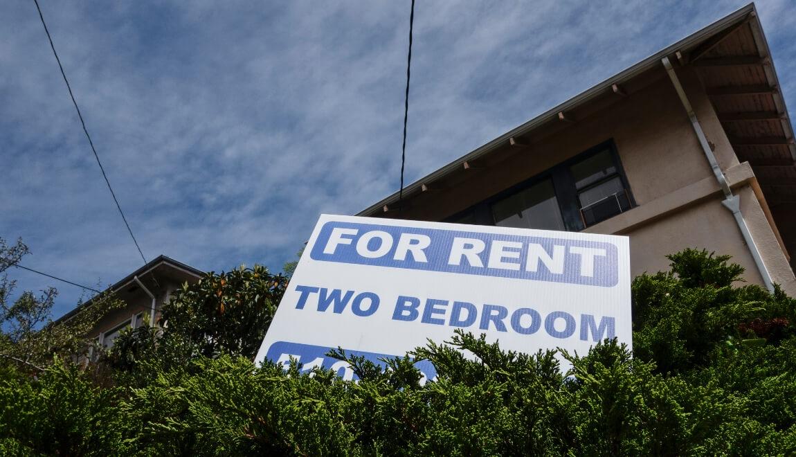 A sign advertising a two-bedroom home for rent.