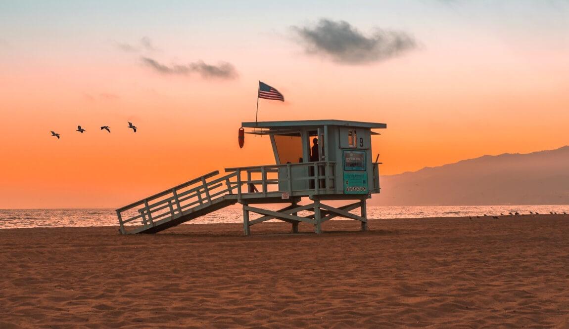 A lifeguard tower at sunset in Los Angeles, CA