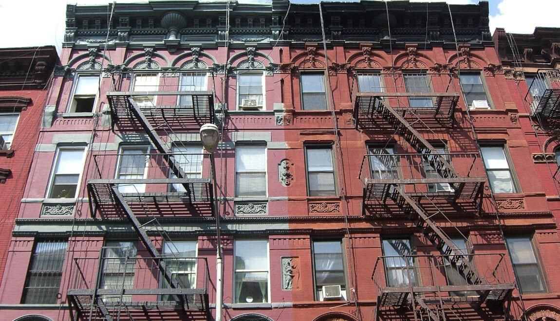 Brick apartments with fire escapes