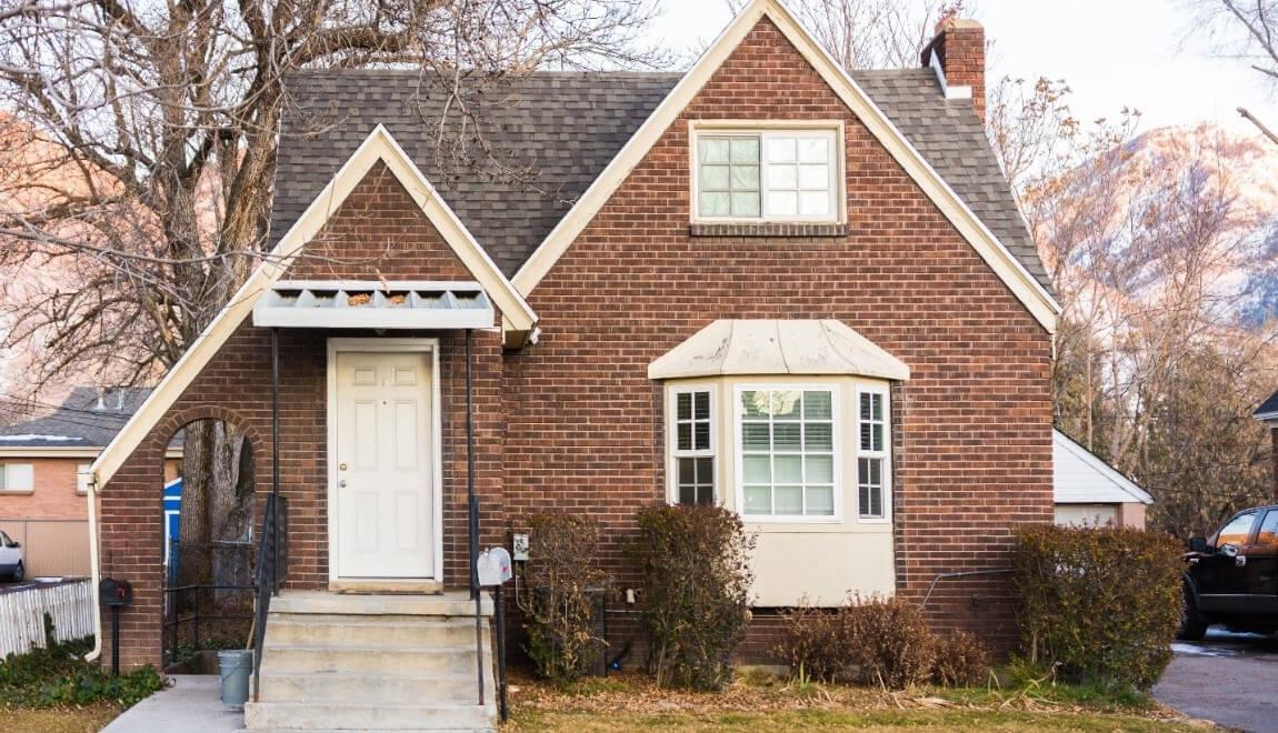 An older looking brick single family home