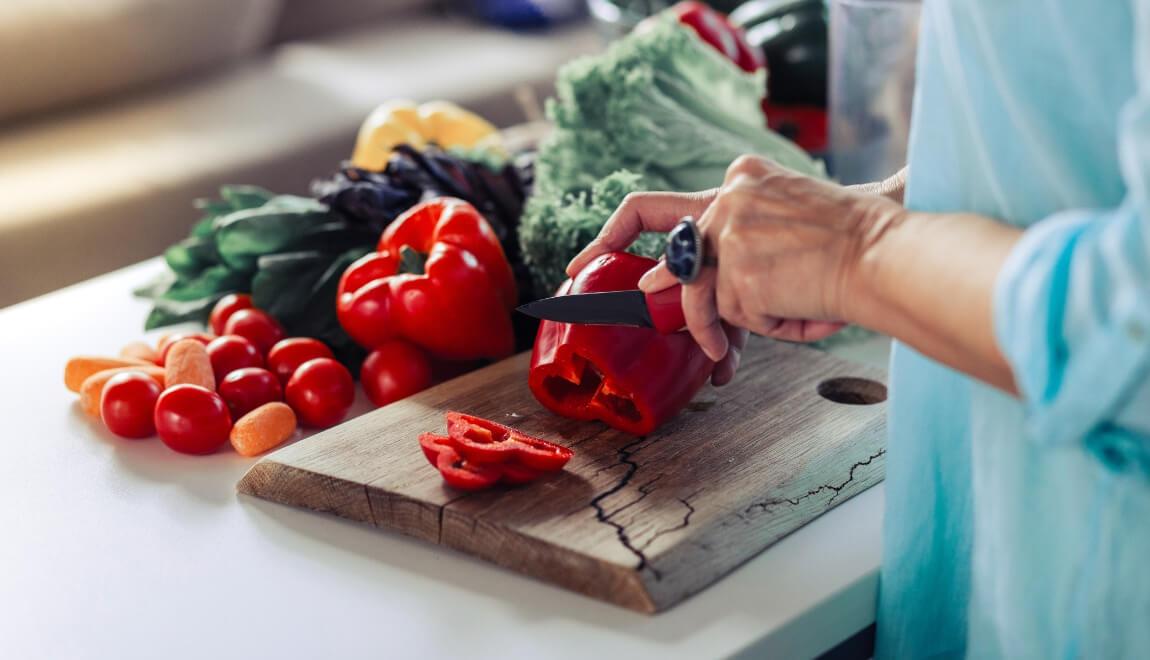 Woman slicing peppers