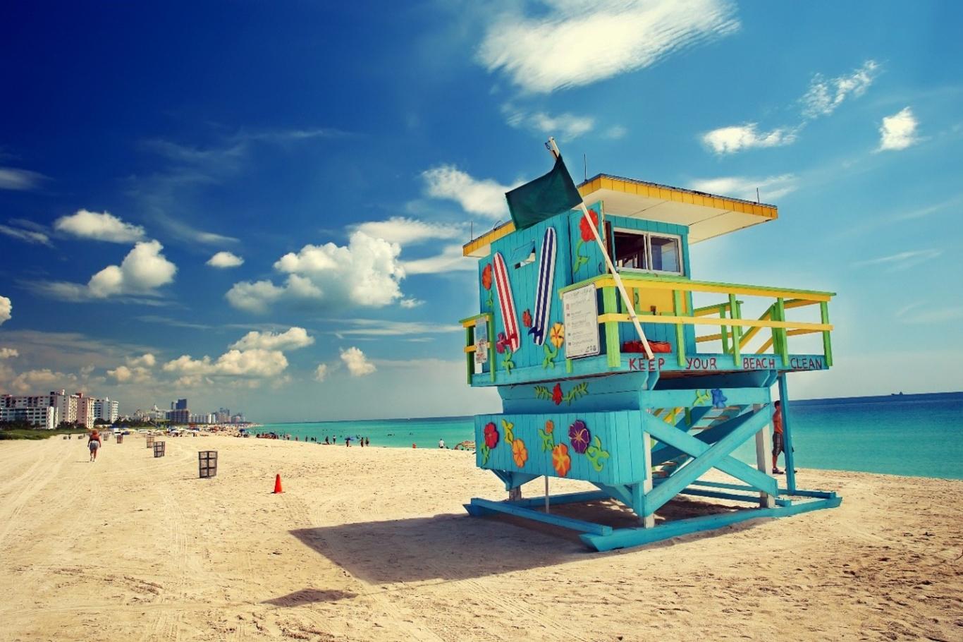 A bright turquoise lifeguard station on a beach in Miami, Florida.