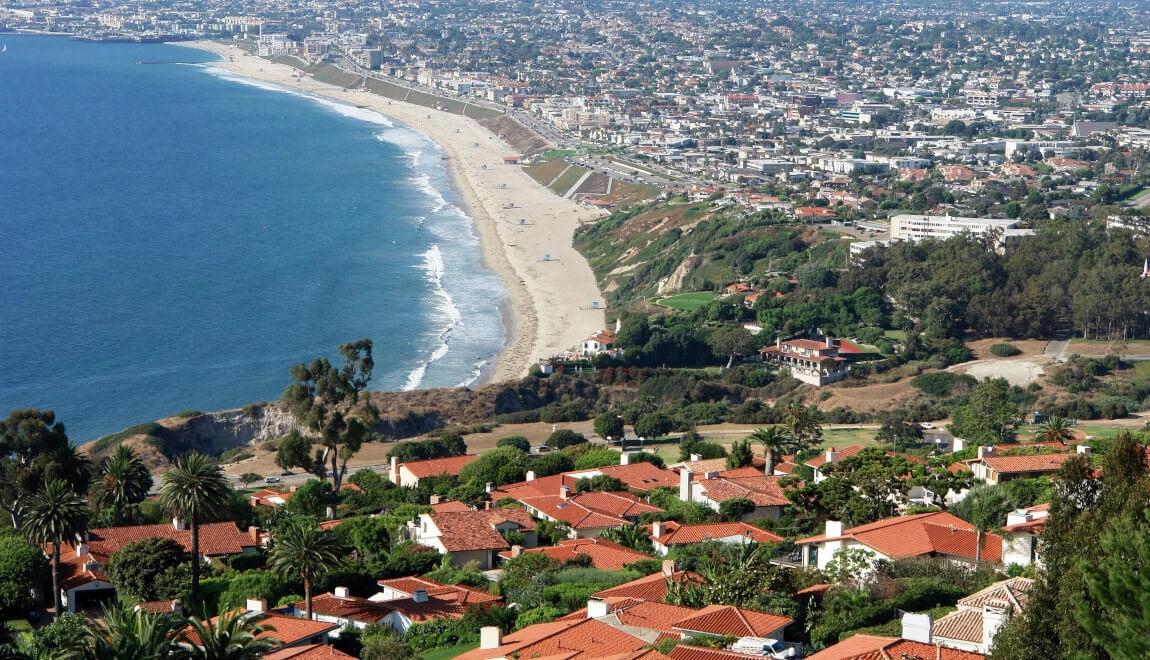 Houses curve along the Los Angeles, California shoreline