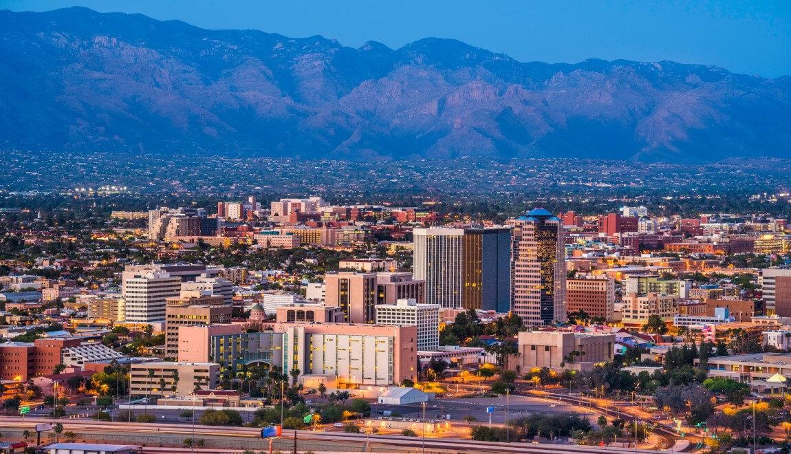 Aerial view of Tucson, Arizona with mountains in the background.