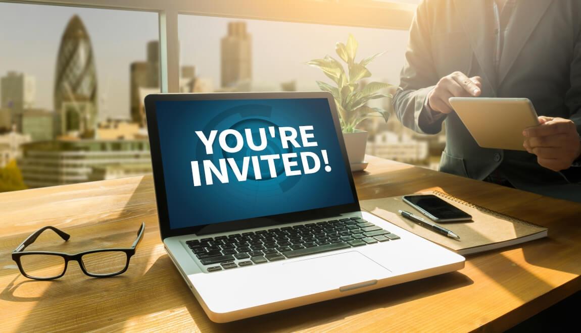 An image of a laptop screen that reads "you're invited."