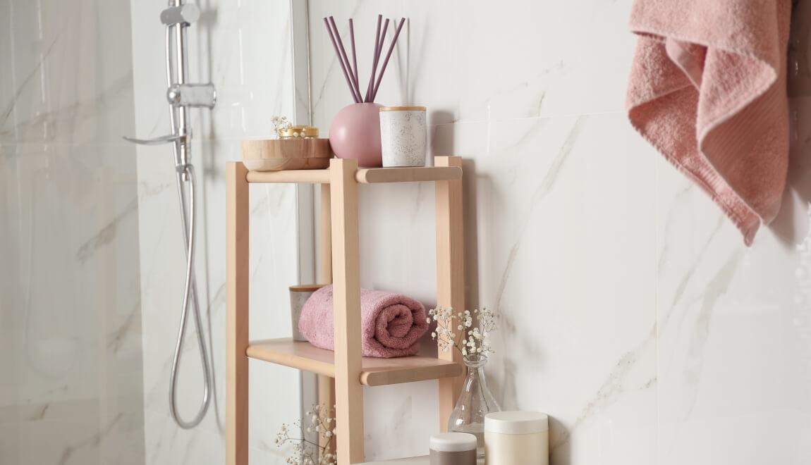 Apartment bathroom is color coordinated with shades of pink.