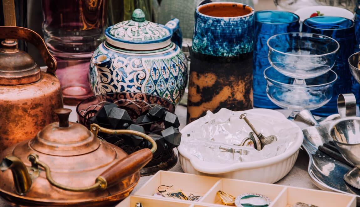 An image of vintage items on a table during a flea market. 