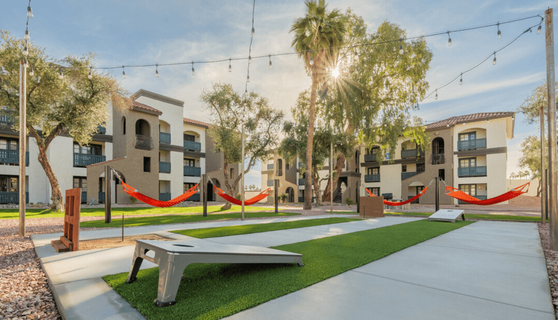 Apartments at Celia have an outdoor recreation center with hammocks and cornhole boards