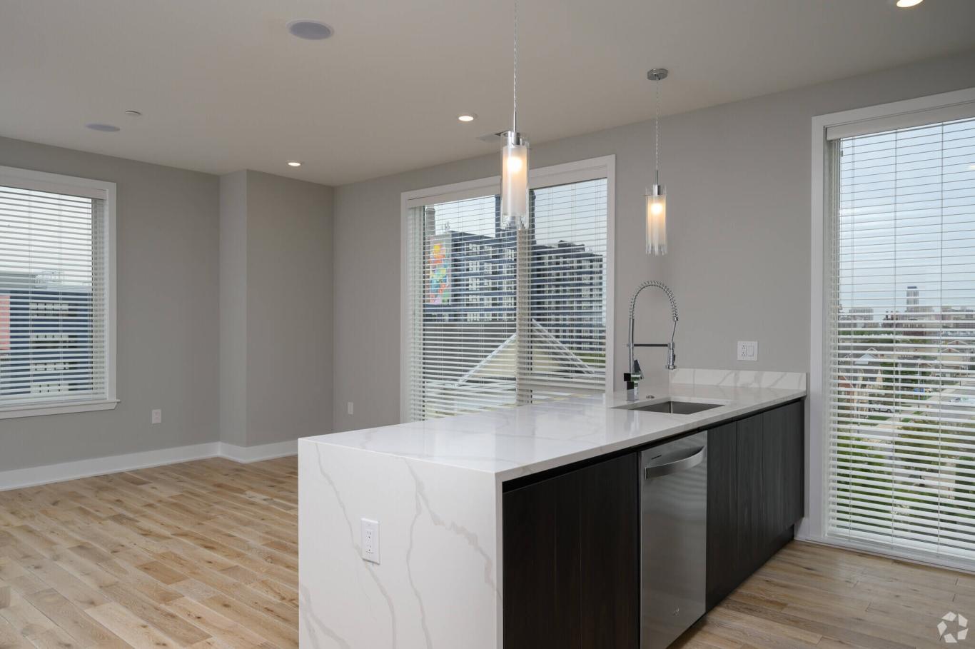 Kitchen with waterfall counter at Veranda Apartments in Philadelphia