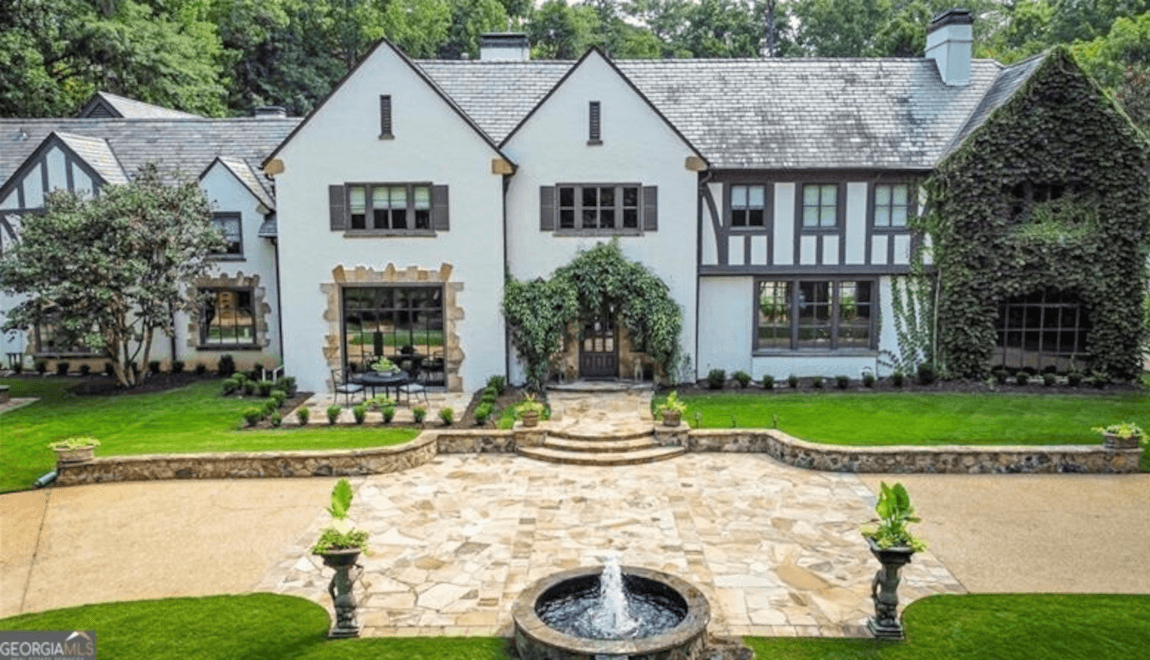 The front yard of 225 Valley Rd NW features a sparkling fountain.
