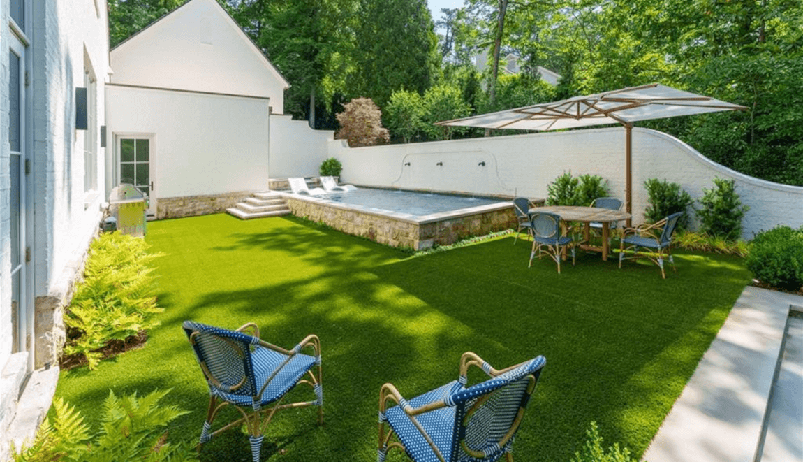 The backyard of 365 Valley Rd NW has a heated pool and spa.