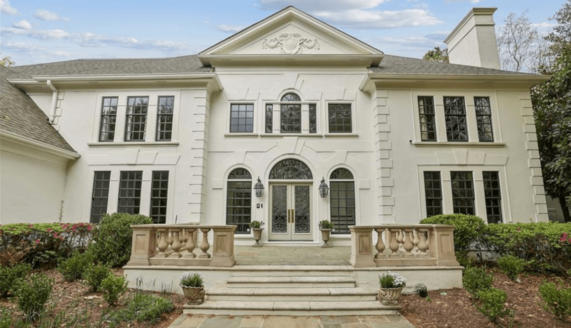 Regal bannisters line the front doorstep of 5760 Powers Ferry Rd NW.