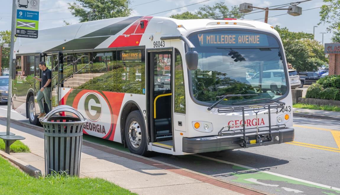 Bus waits at bus stop in Athens, GA.