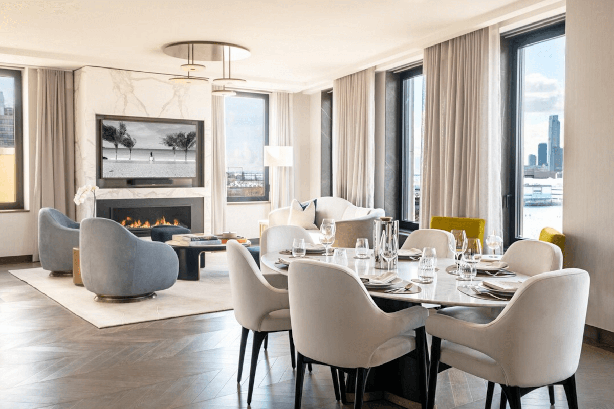The living room at 401 West Street features a marble fireplace and hand-laid oak and walnut floors.
