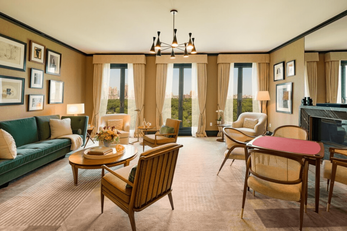 Windows in the living room at 815 5th Ave give residents a view of Central Park.