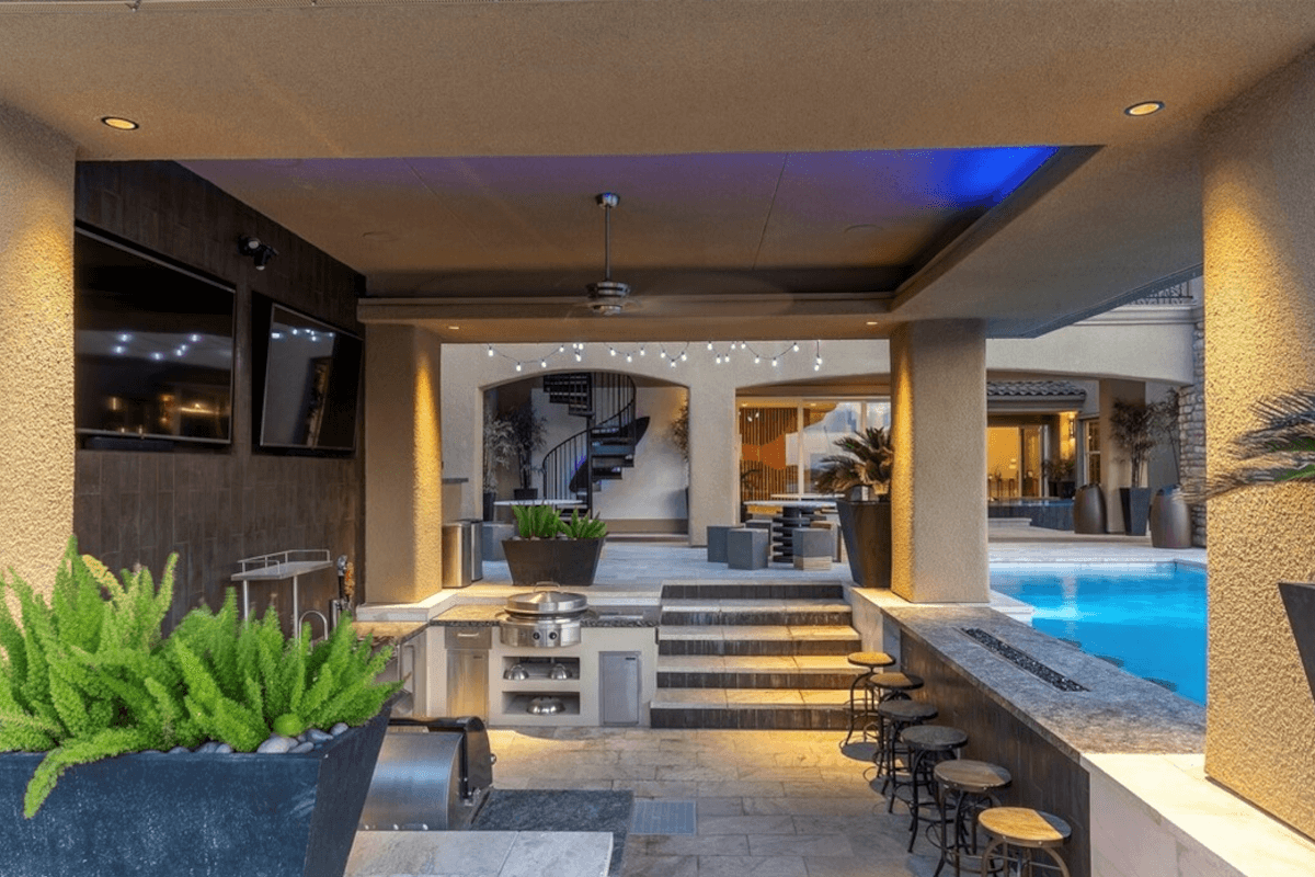 36 Olympia Ridge Drive has a sunken bar area at pool level.