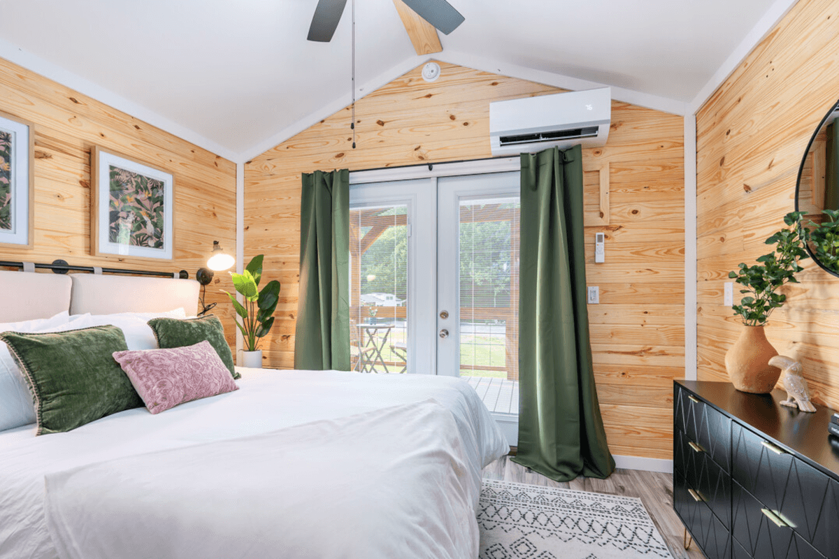 The bedroom in 4307 Bakers Chapel Road has French doors leading to the back patio.