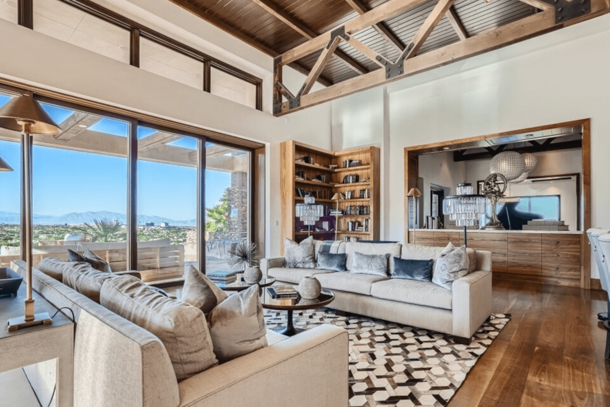 The living room in 5 Promontory Pointe Lane provides an unobstructed view of the mountains and the Strip.