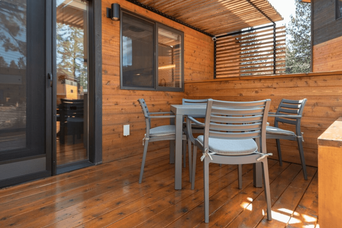 The back porch of 61304 Wizard Lane is connected to the bedroom and is partially shaded.