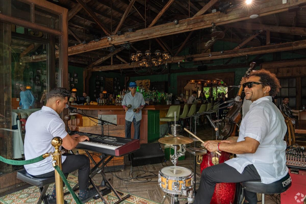 Musicians play music at a restaurant in Little Havana.