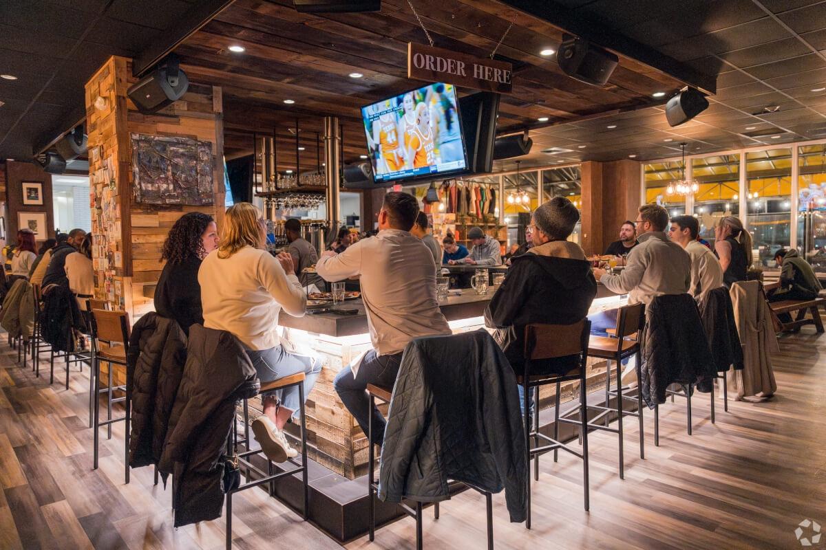 Residents of Philadelphia enjoy community at a local bar.