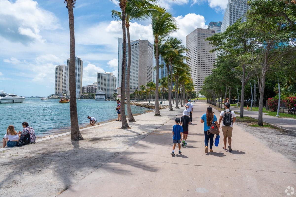 People stroll along Bayfront Park in Downtown Miami.