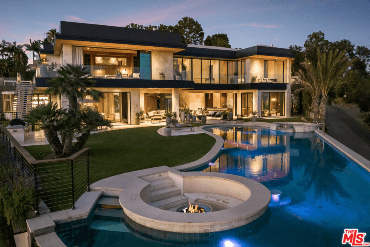 A sunken firepit sits at the same level as the resort-style pool at 1625 Summitridge Drive.