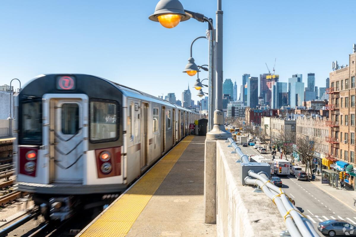 The 7 train speeds through the Sunnyside neighborhood in Queens, New York.