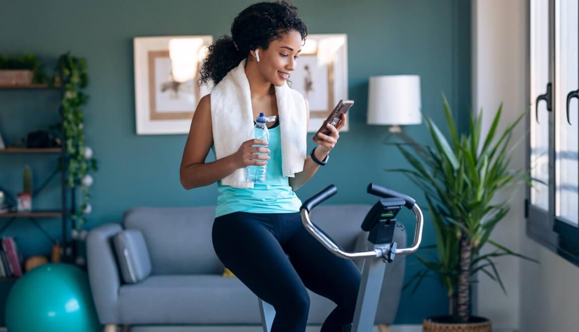 Renter doing a cycling workout in her apartment.