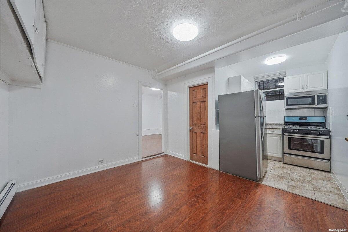 The small kitchen in 1754 Seward Ave Unit LL is next to the living room.