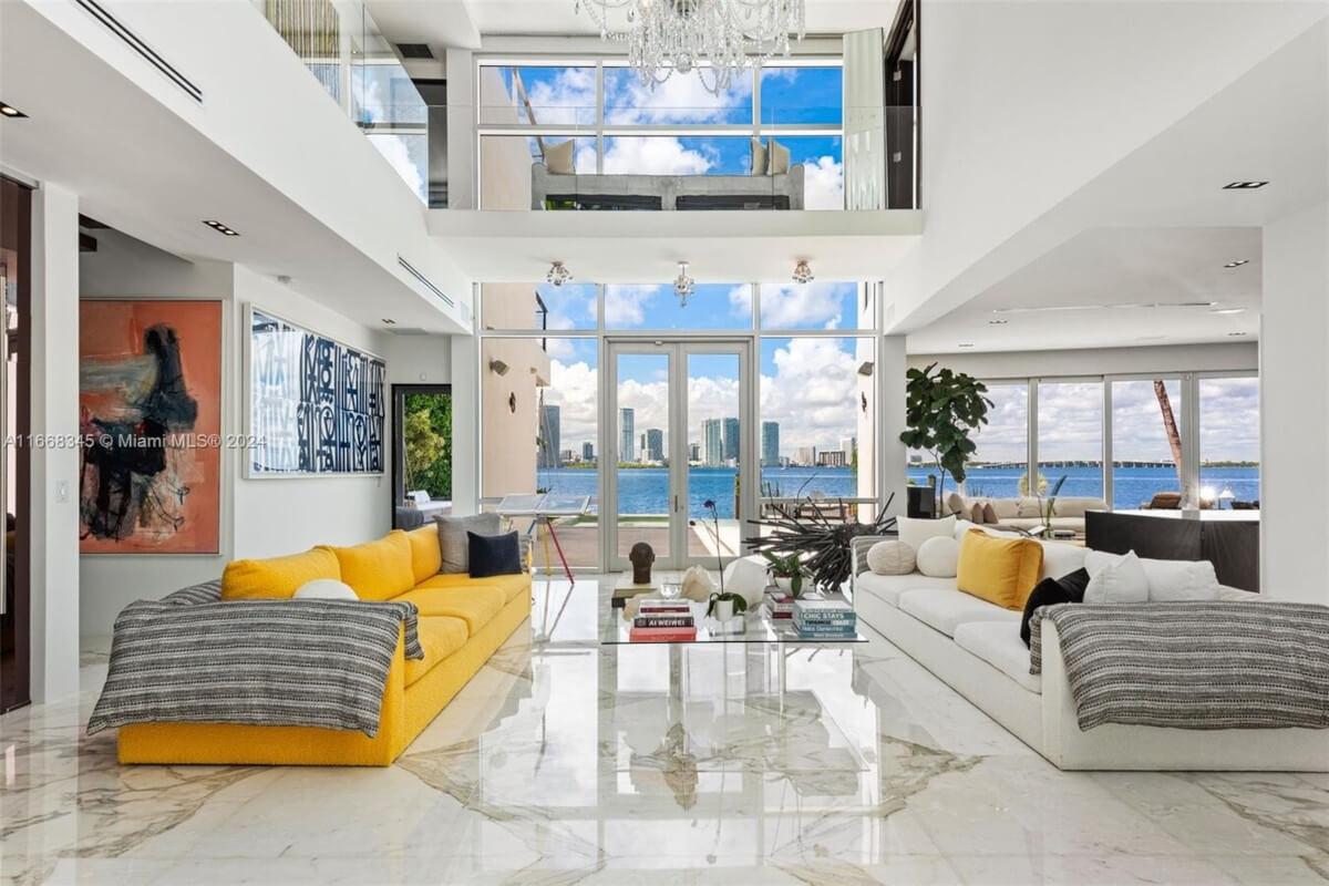 The living room at 420 West San Marino Drive has a 30-foot ceiling with a sparkling crystal chandelier.