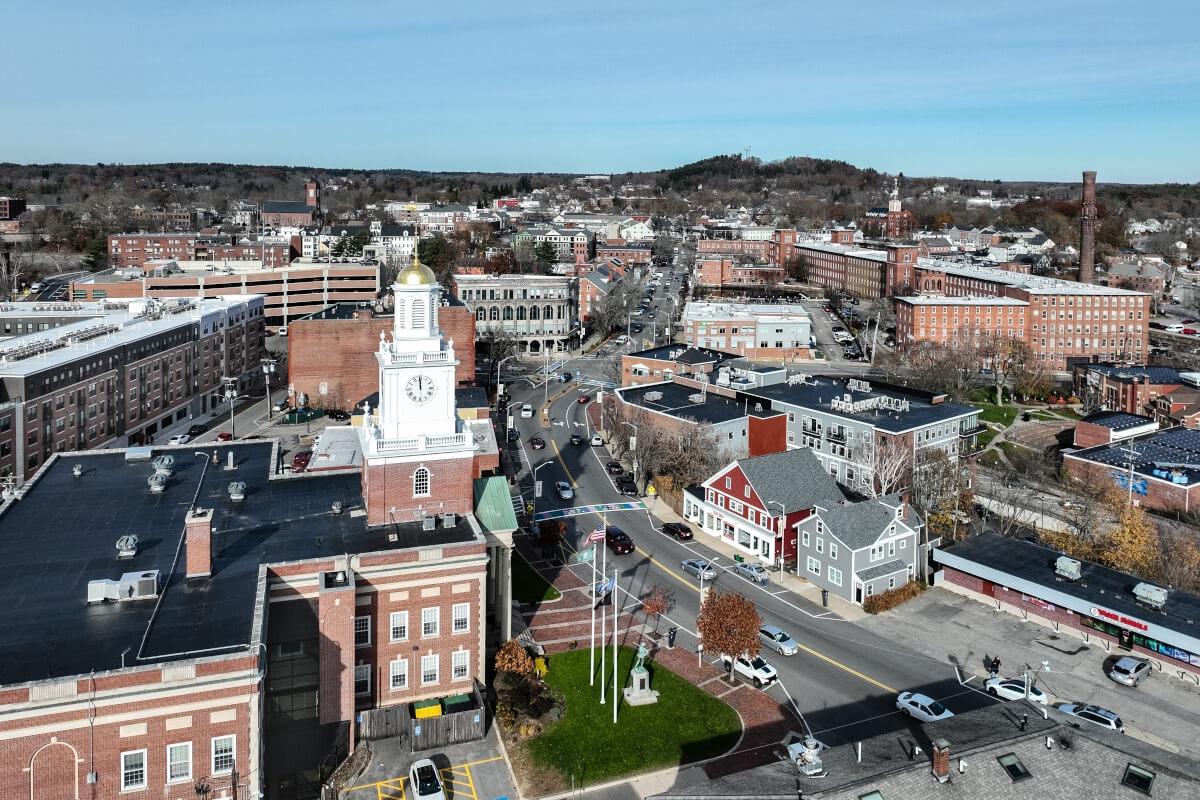 An aerial view of Downtown Dover shows red brick buildings along Main Street.