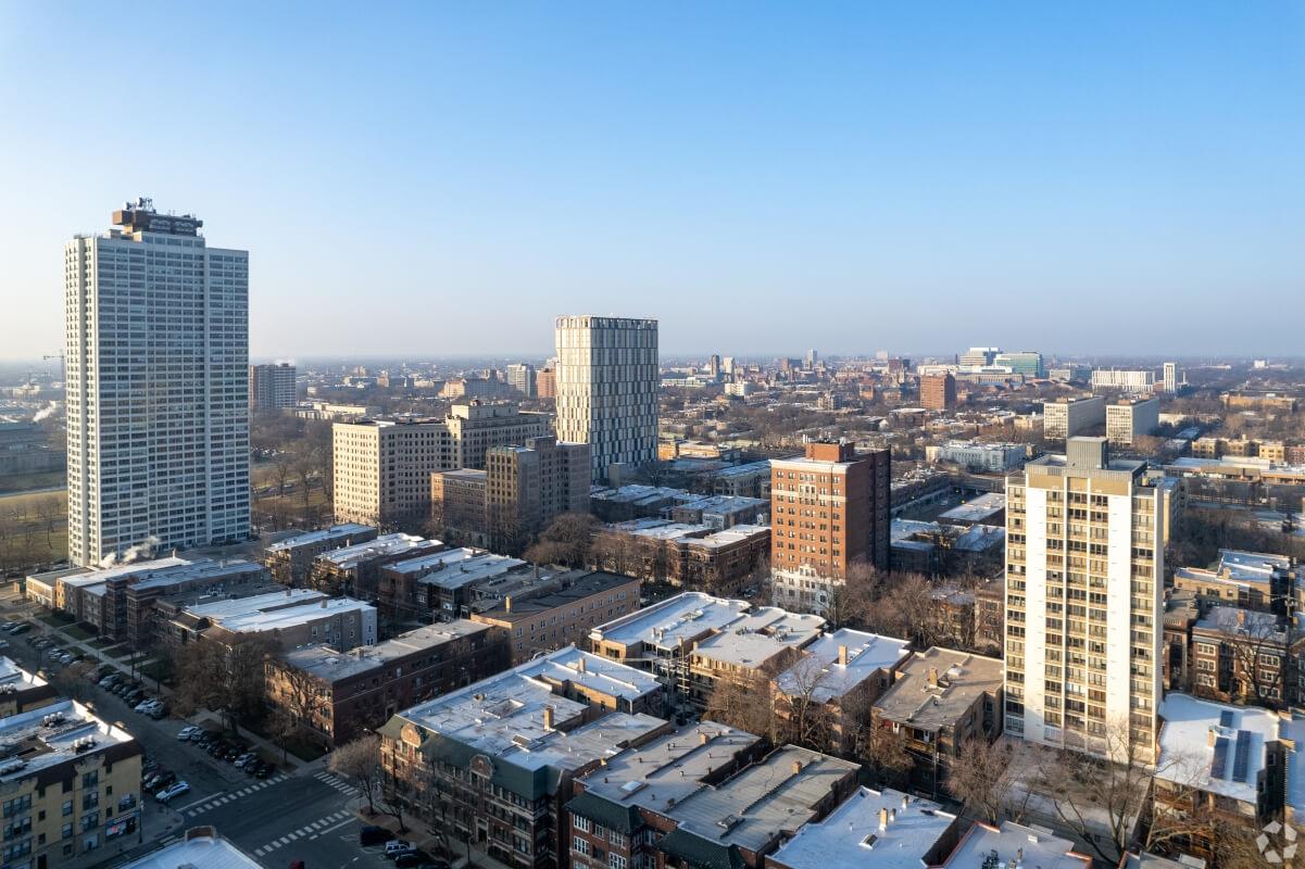 High shot of Hyde Park in Chicago, showcasing some tall buildings on the edge of shorter ones.