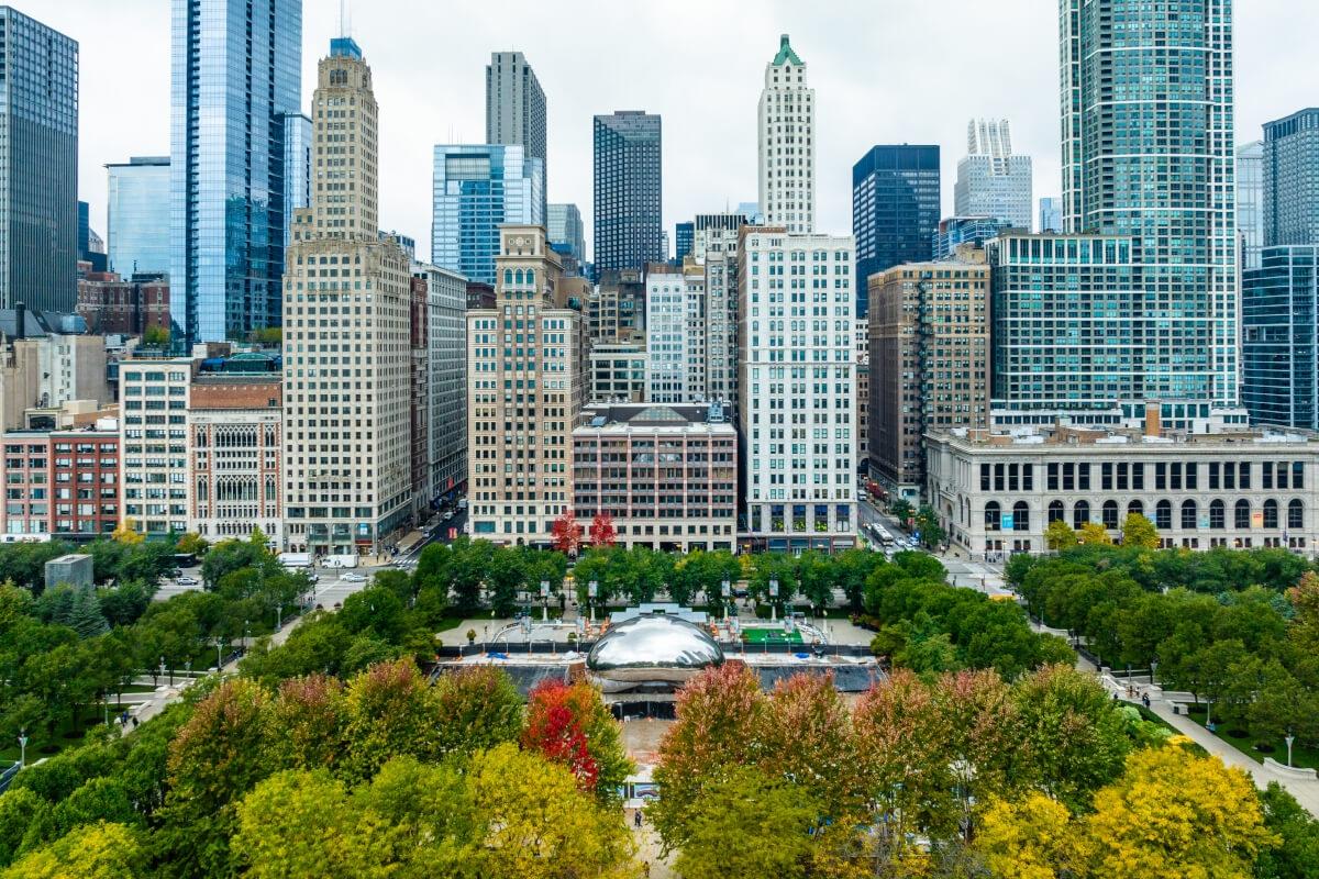 The Chicago skyline towers over The Bean in Millennium Park.