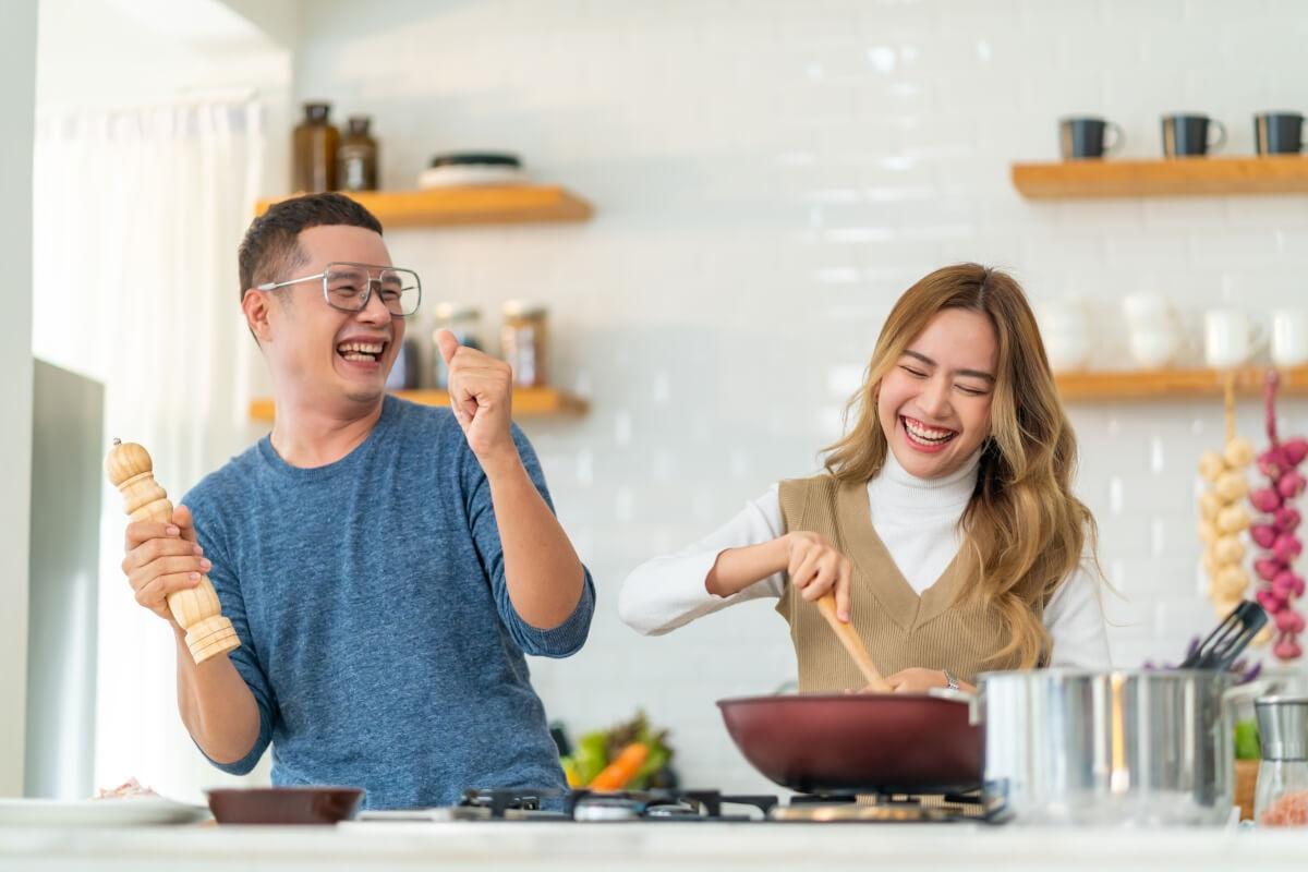 Tenants enjoy each others' company in the coliving kitchen.