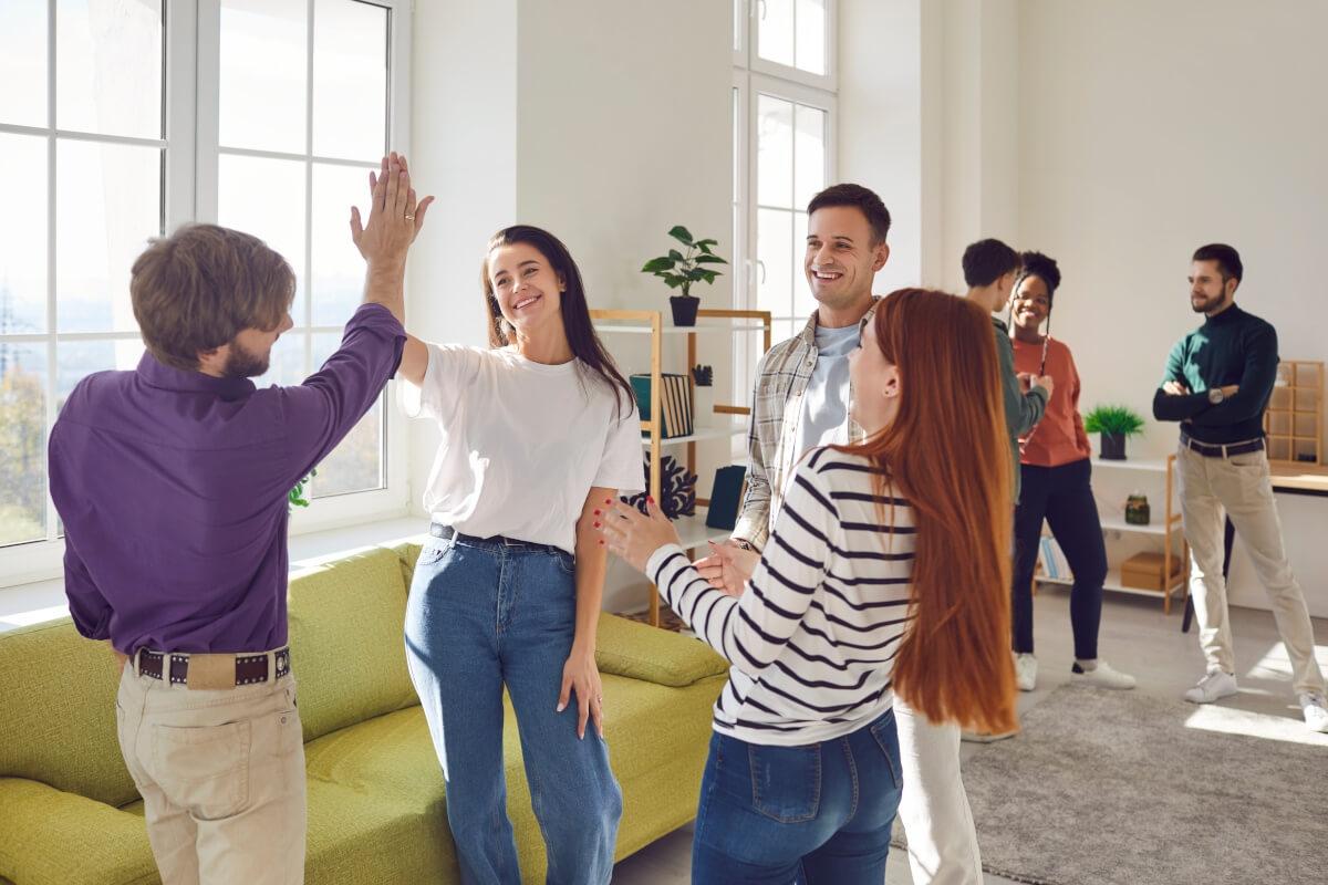 Tenants hang out in coliving communal living area. 