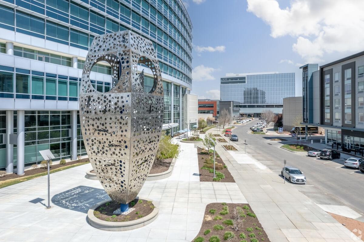 A silver sculpture outside a glass building in Downtown Omaha, NE.