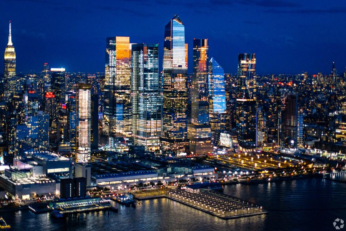 Skyscrapers light up Manhattan at night.