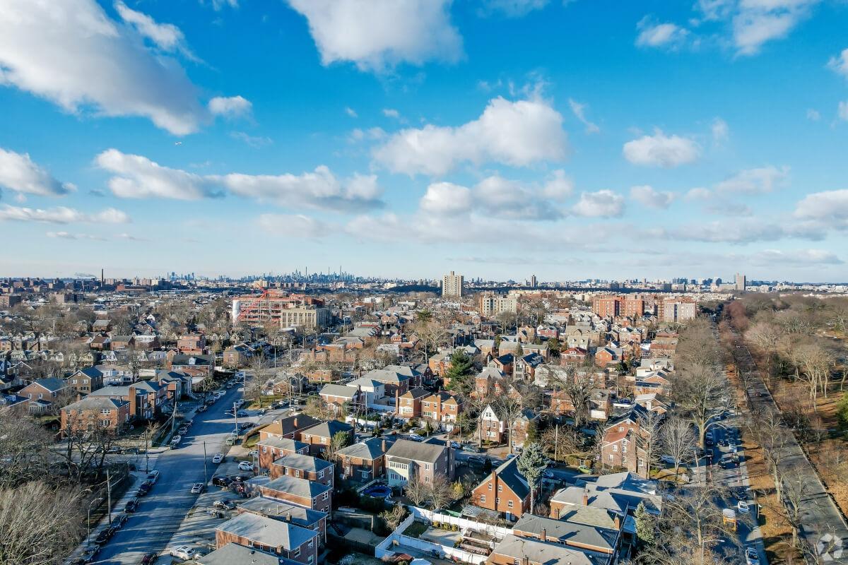 An aerial view of Morris Park shows the Manhattan skyline in the distance.