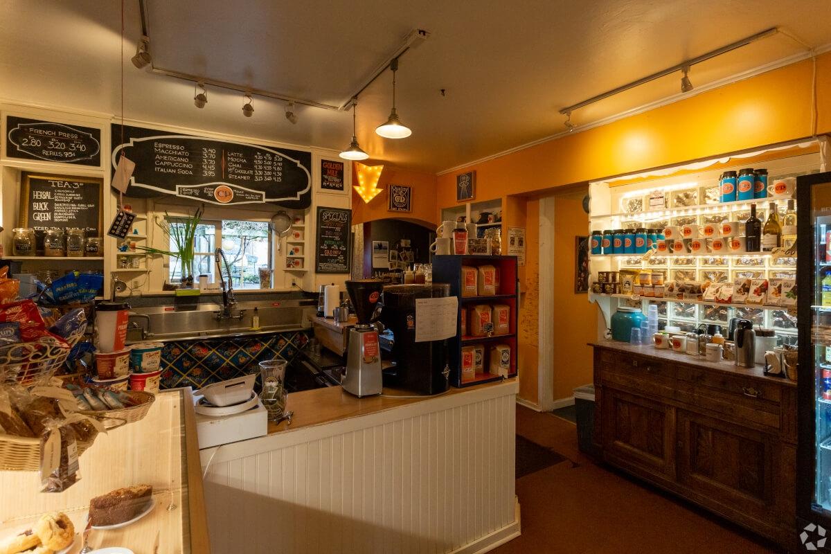 C&P Coffee Company is filled with snacks and coffee beans for sale.