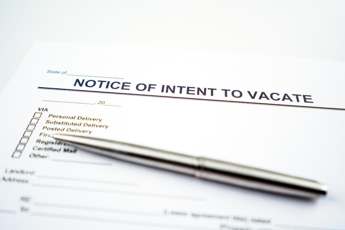 Pen on top of a Notice of Intent to Vacate.