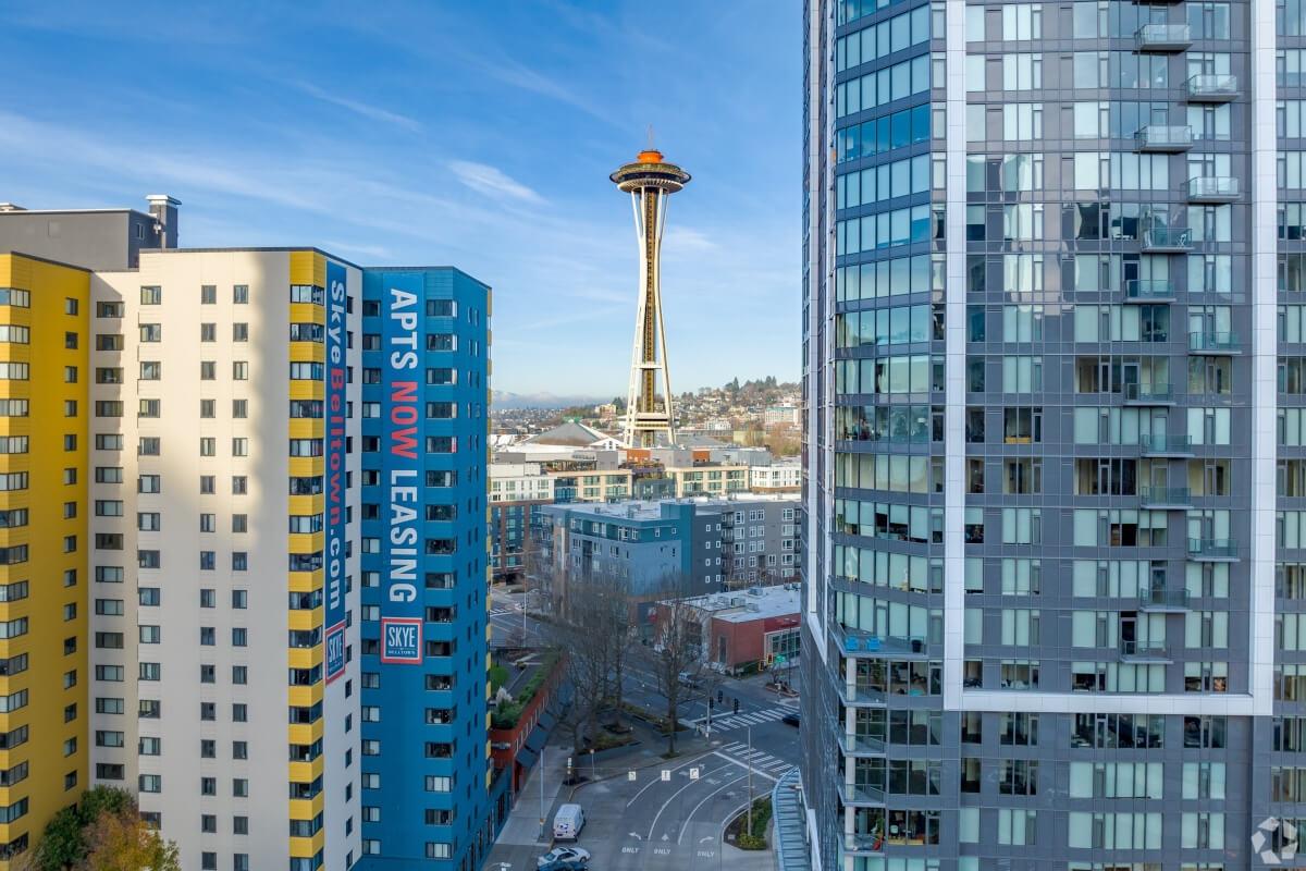 The Seattle Needle can be seen through a gap between two apartment buildings in Seattle, WA.