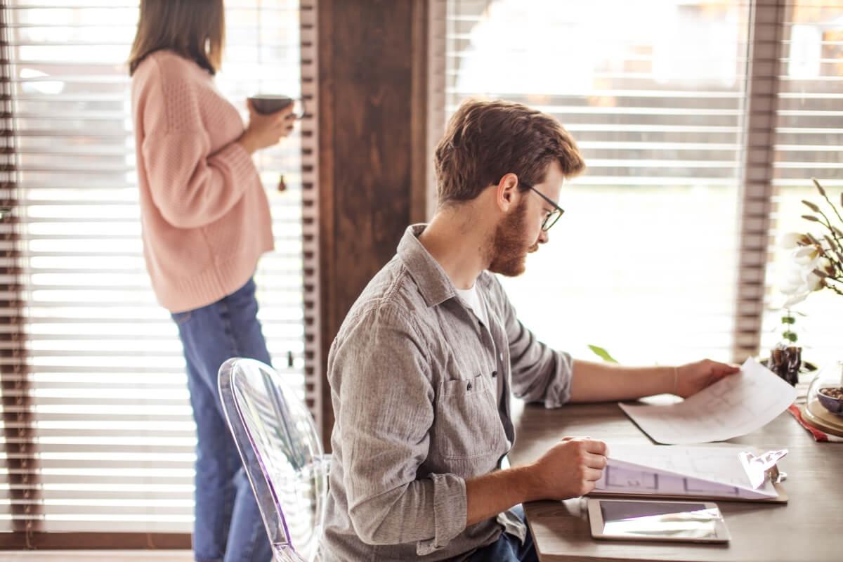 Renter reviewing his lease before moving into first apartment.