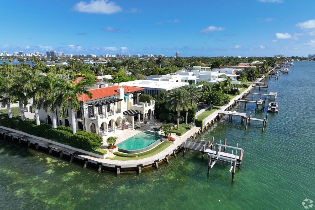 Luxurious waterfront estate on Biscayne Point with private docks and tropical landscaping — upscale living in Miami’s prime rental neighborhoods.
