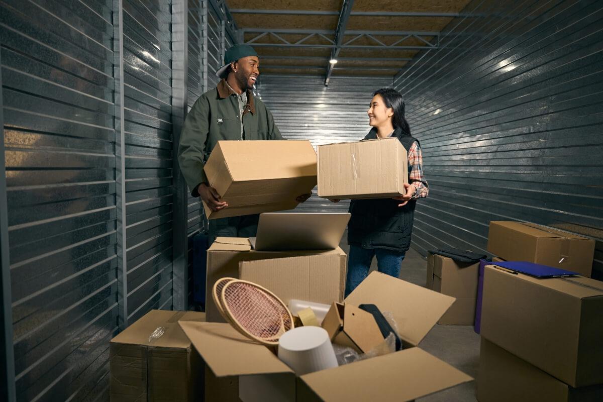 Tenants unbox boxes in their apartment storage unit.