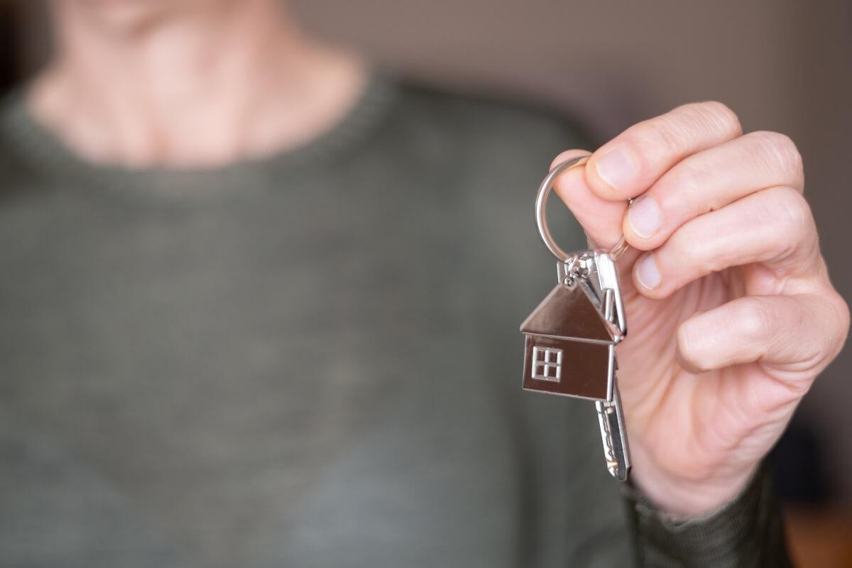 Tenant holds keys to their apartment. 