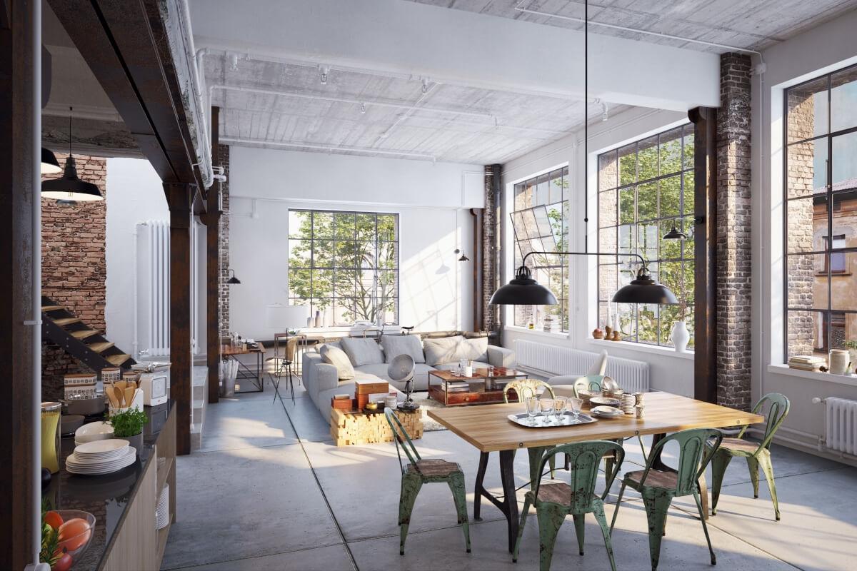 A view of an industrial loft with exposed brick and industrial-style lighting.