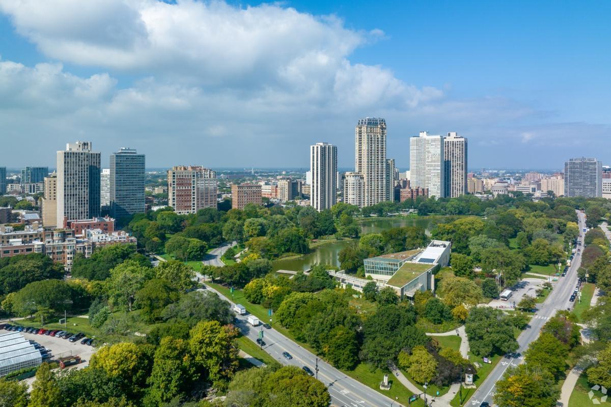 Scenic view of Douglas Park hill with rock sculptures and the downtown Chicago skyline in the distance, offering unique outdoor space near apartments.