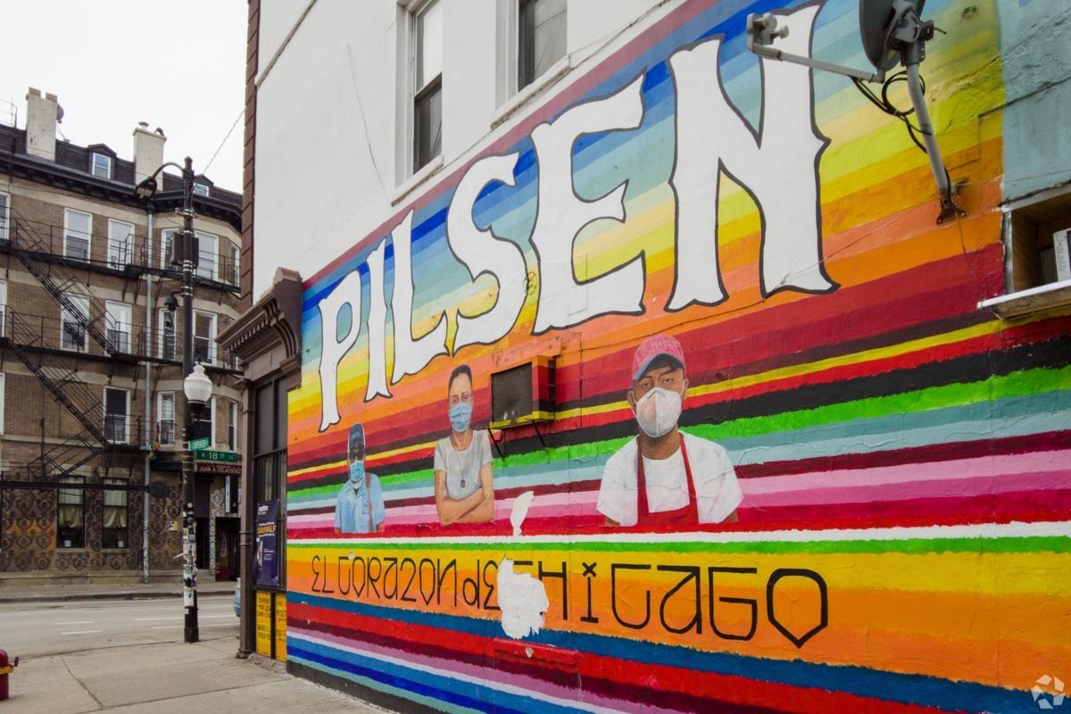 Colorful street mural in Chicago’s Pilsen neighborhood highlighting local culture and vibrant community life near urban apartments.